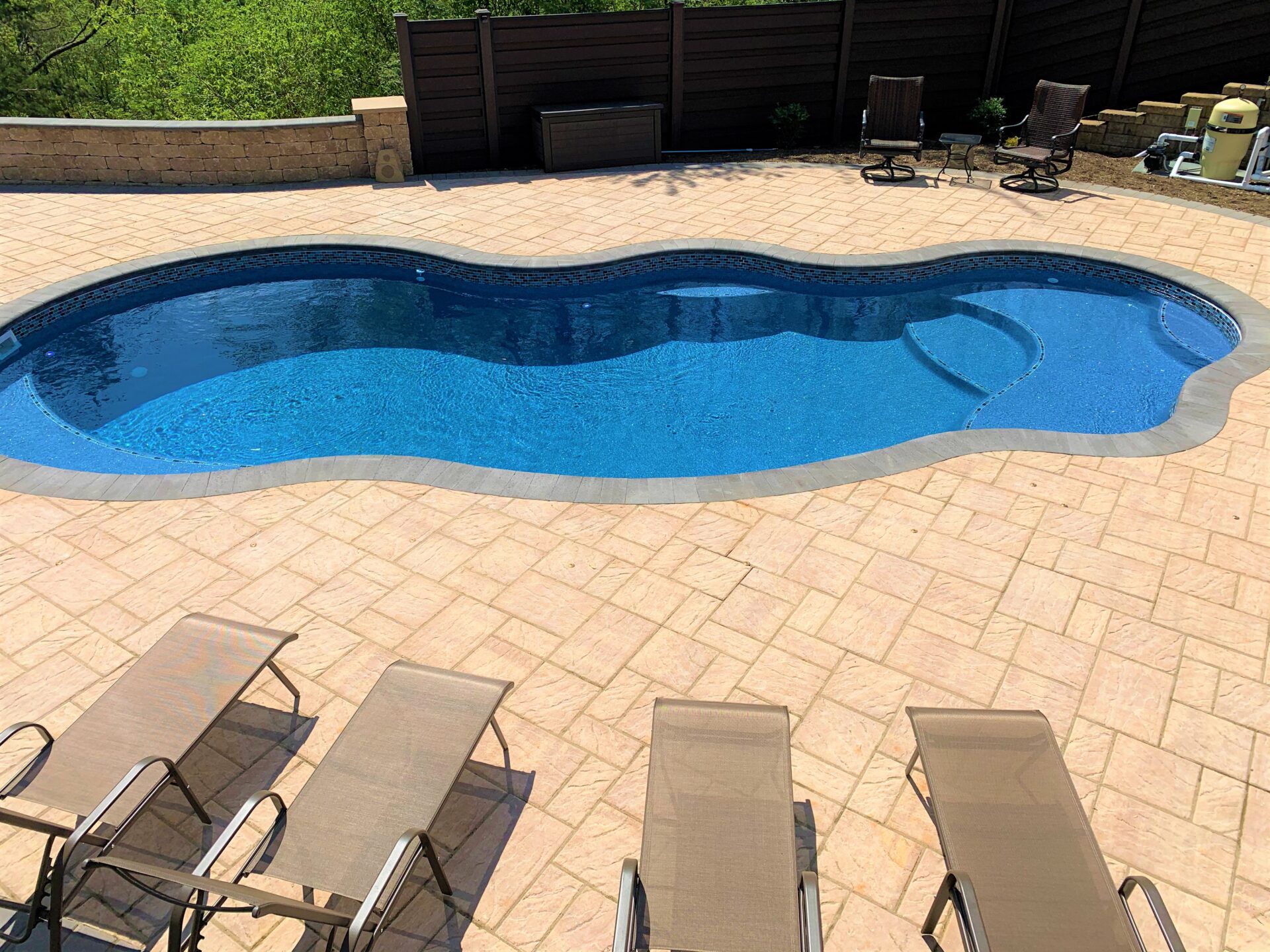 An irregular-shaped swimming pool